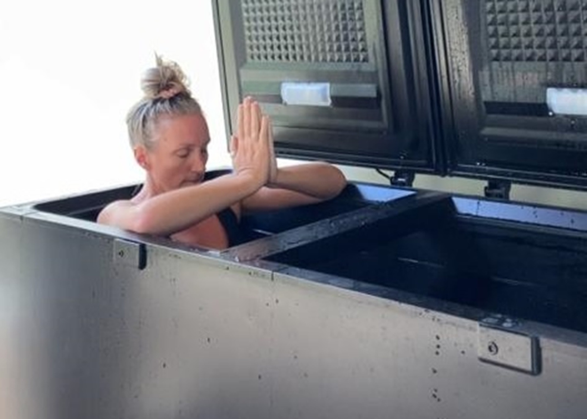 Guest in the stainless-steel cold plunge