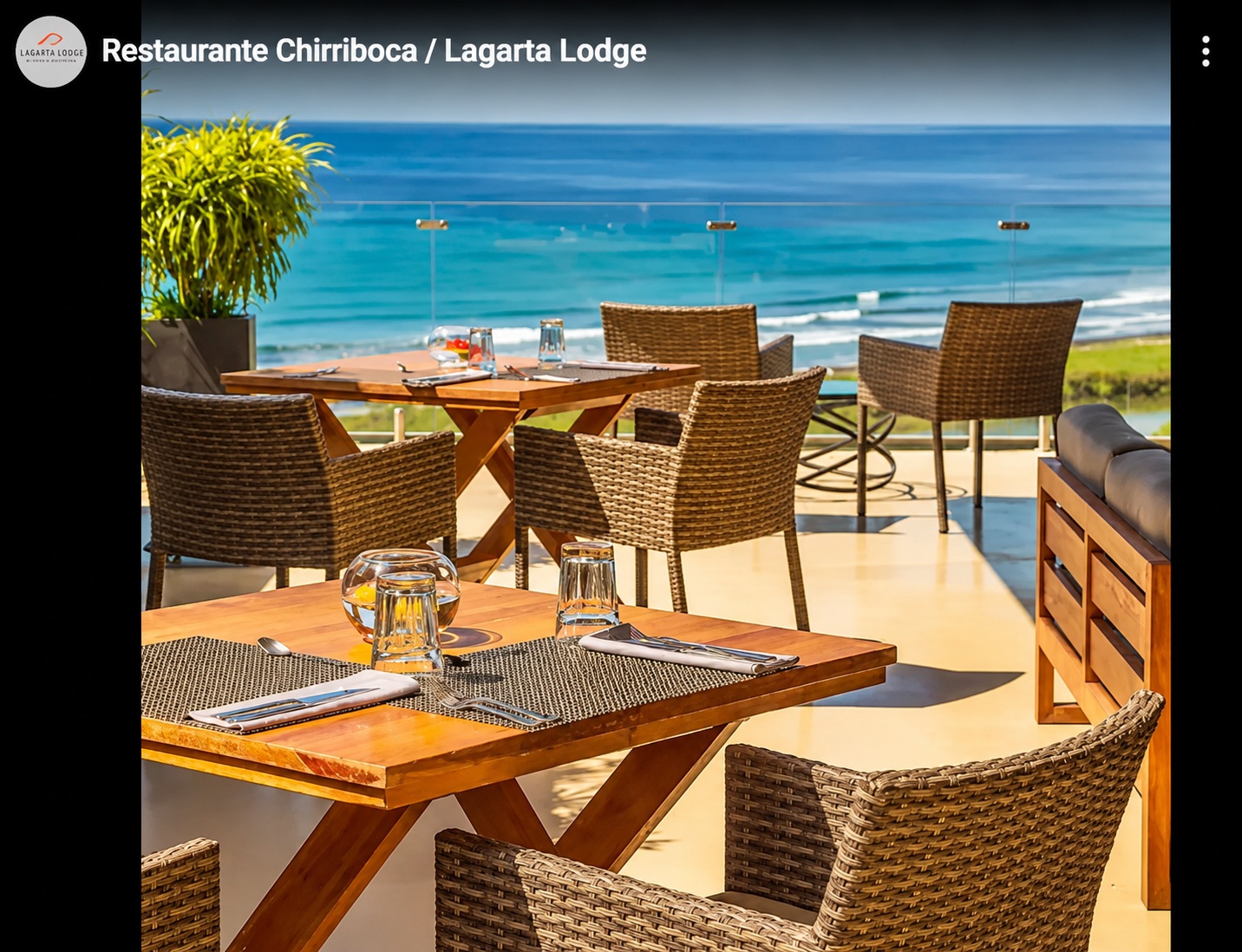 Oceanview teak tables on the Restaurante Chirriboca terrace at Lagarta Lodge, overlooking the Pacific surf.